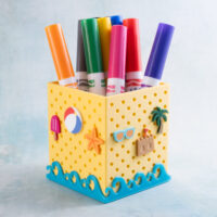 summer beach charms with waves on yellow pen holder