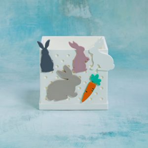rabbits and carrot snaps on 3 inch white snappy pot
