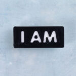 Black and white word charm i am