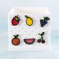 Fruit charms set on white planter