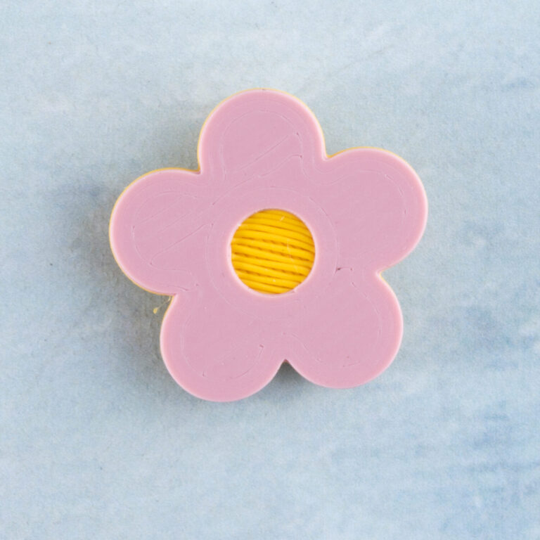 Pink flower charm front