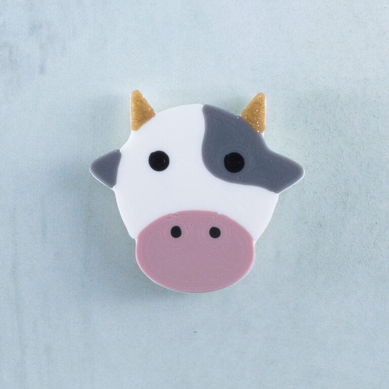 Gray white cow charm