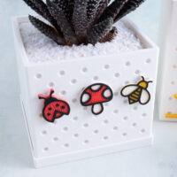 Snappy planter with ladybug mushroom bee charm on charms