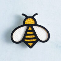 Yellow black white bee charm