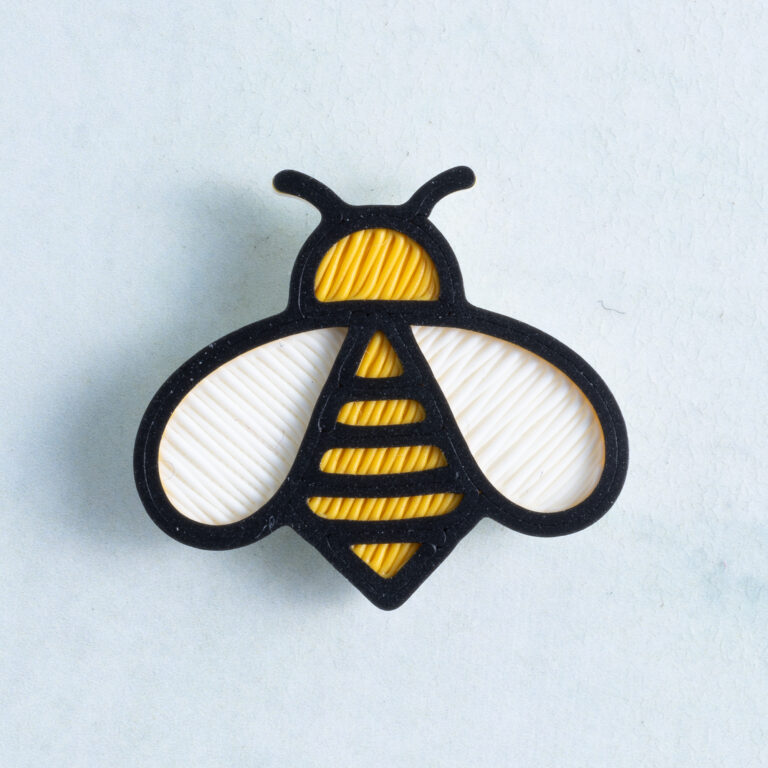 Yellow black white bee charm