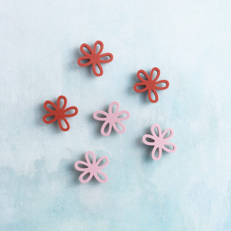 Small pink red flower charm on charms front