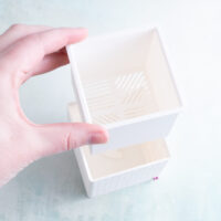 White succulent snappy pot planter liner offset hand sliding it in