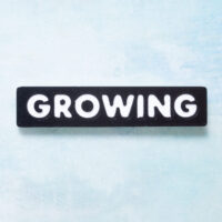 Growing word charms snappy pots