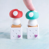 red and green mushroom clicker fidgets snappy pots green pressed down