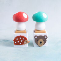 red and green mushroom clicker fidgets snappy pots porcupine and bear charms
