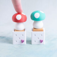 red and green mushroom clicker fidgets snappy pots red pressed down