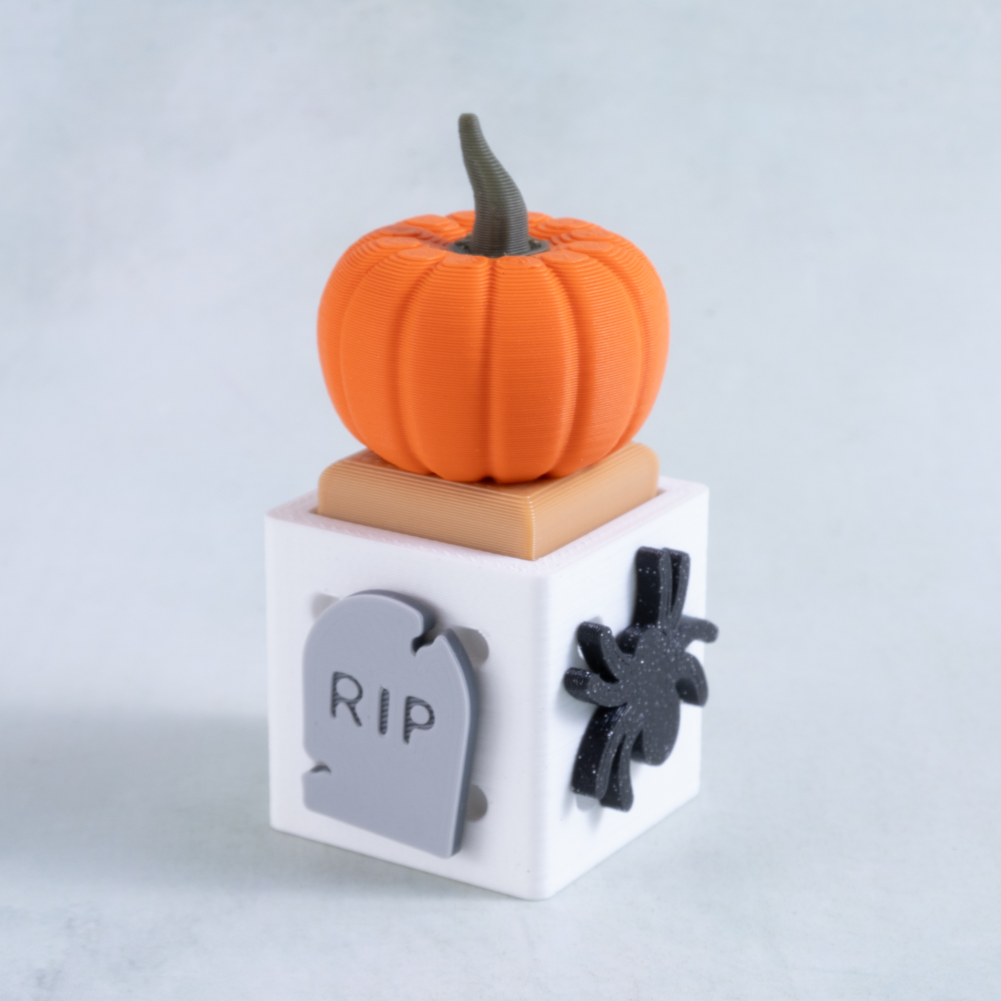 pumpkin clicker fidget toy snappy pots with tombstone and spider