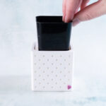 snappy pot nursery cover 2-inch with liner partially out