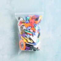 Assorted snappy pots charms in bag