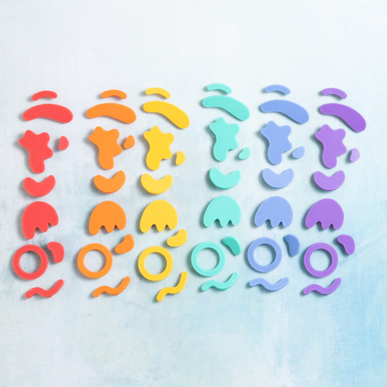 Squiggle shapes charms in six rainbow colors