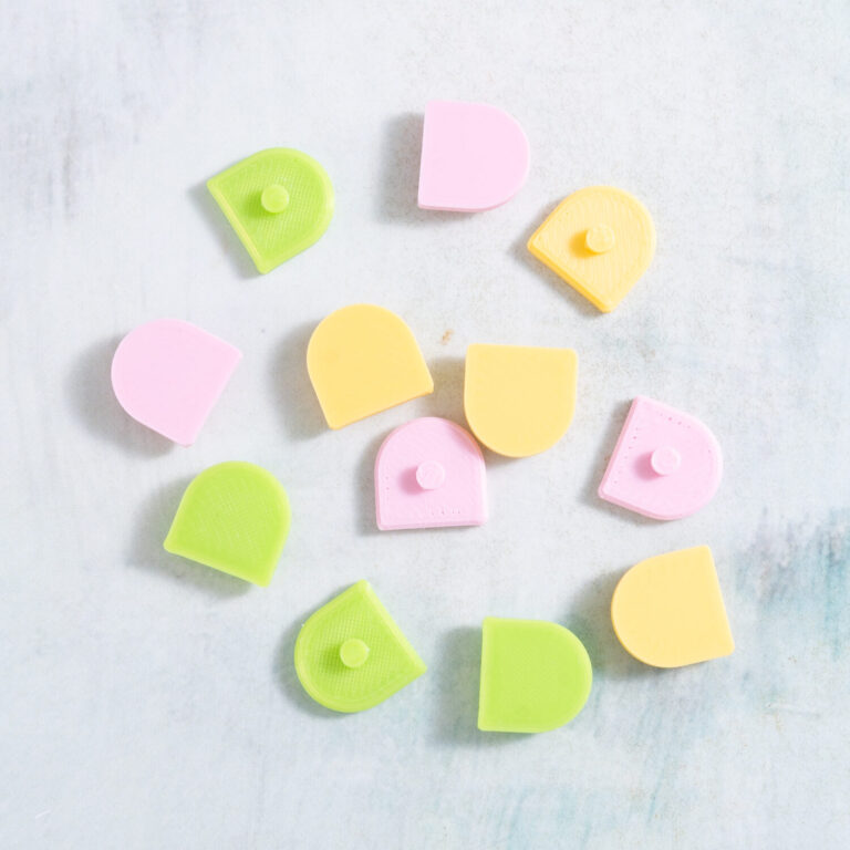 Summer combo scallop charms in pastel pink, lime green, and banana yellow from Snappy Pots